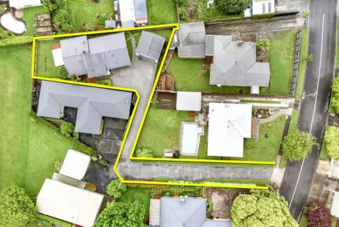 TNT is responsible for maintaining the lawn strip on the right side of the road entry.